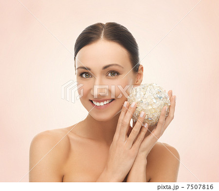 woman with salt ball for bathing 7507816