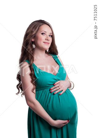 Lovely pregnant woman touching belly 7511025