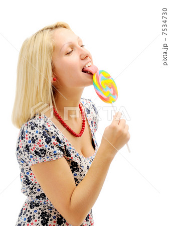 Attractive blonde licking lollipop Attractive blonde licking lollipop 7534730