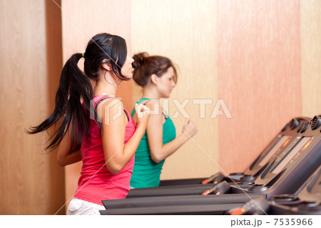 Young women on a running simulator 7535966