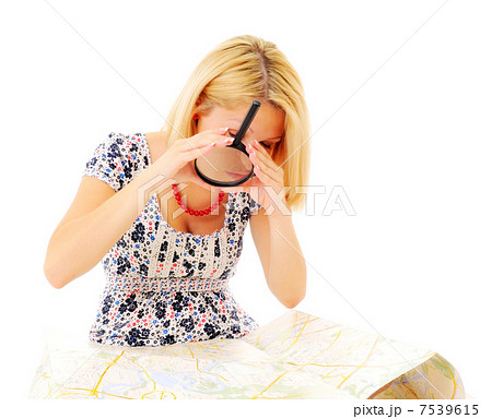 Attractive young blonde studying map Attractive young blonde studying map 7539615