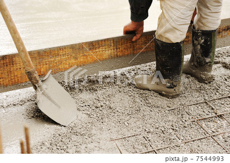 Man leveling concrete slab Man leveling concrete slab 7544993