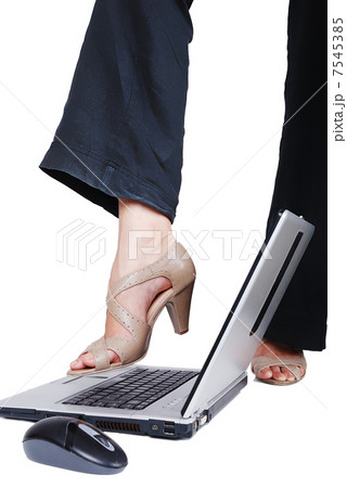 Female leg on laptop Female leg on laptop 7545385