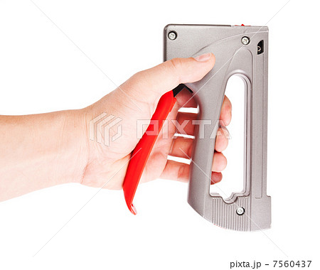 Professional staple gun in the hand isolated over white backgrou 7560437