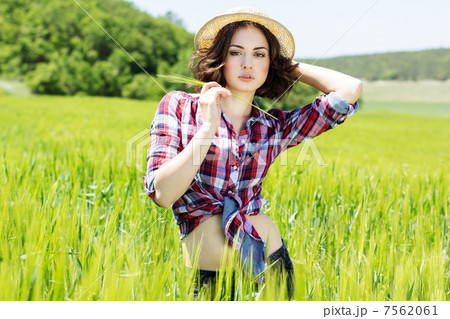 Beautiful woman in hat on summer meadow Beautiful woman in hat on summer meadow 7562061