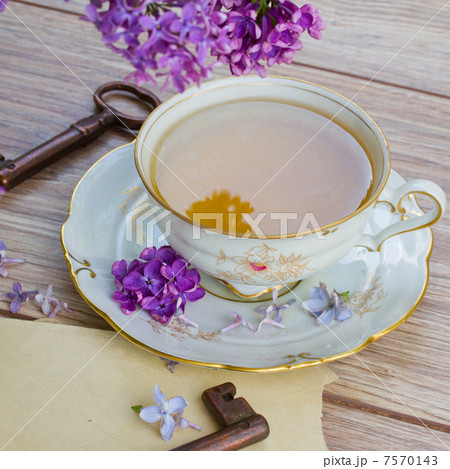 antique cup of tea with lilac 7570143