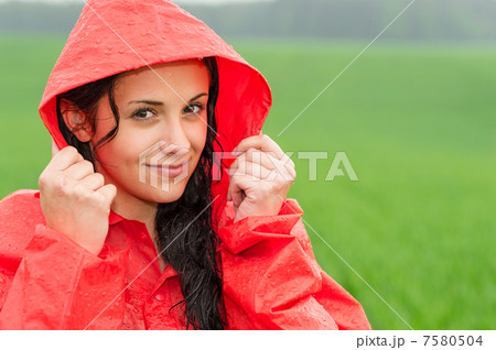 Adolescent girl in the rain in cloak Adolescent girl in the rain in cloak 7580504