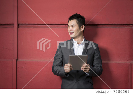Chinese man with a tablet computer. 7586565