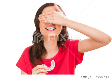 Closeup portrait of charming woman wearing orthodontic braces ho Closeup portrait of charming woman wearing orthodontic braces ho 7590741