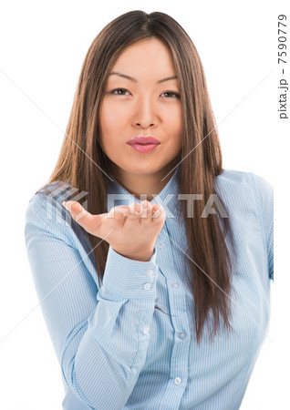 Closeup portrait of cute young business woman sending air kiss i 7590779