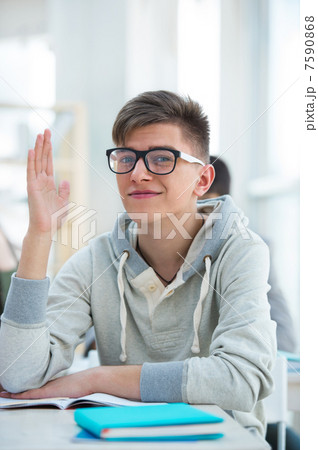 High School students. Student raising his hand in university 7590868