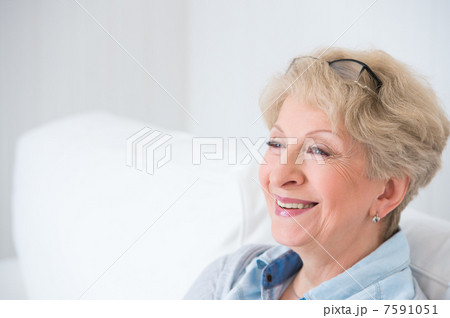 Senior woman portrait, at home with white hair 7591051