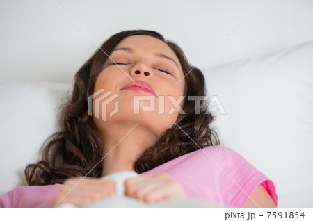 Young beautiful woman sleeping on the bed Young beautiful woman sleeping on the bed 7591854