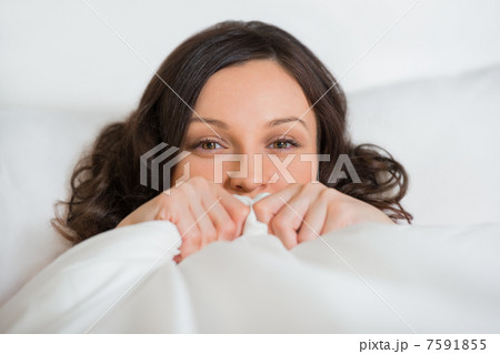 Girl hides her face in bed Girl hides her face in bed 7591855