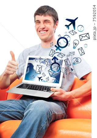 Closeup of a young smiling business man sitting at his home offi 7592054