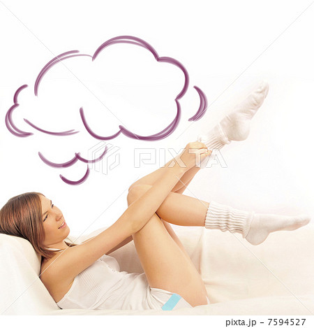 Closeup portrait of beautiful young brunette woman on the bed at 7594527