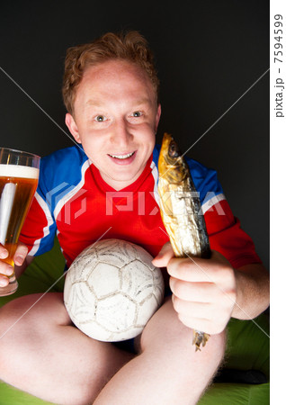 Closeup portrait of young man wearing sportswear fan of football 7594599