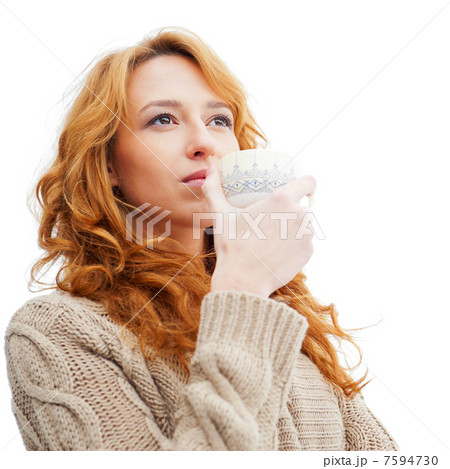 Portrait of beautiful red hair girl drinking coffee on winter ba Portrait of beautiful red hair girl drinking coffee on winter ba 7594730