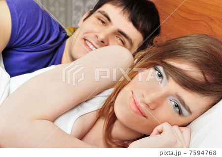 Young man and woman in bed. Couple. Young man and woman in bed. Couple. 7594768