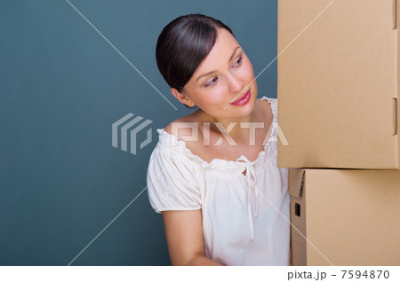 Closeup portrait of a young woman with boxes Closeup portrait of a young woman with boxes 7594870