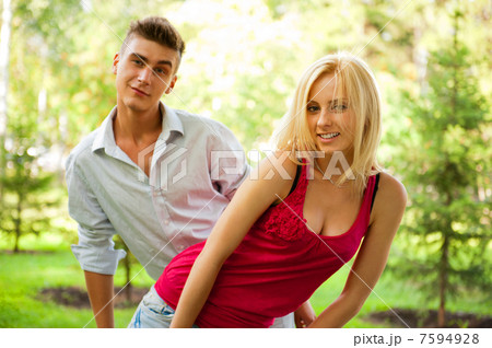 Portrait of young pretty woman and her male gay friend playing t Portrait of young pretty woman and her male gay friend playing t 7594928