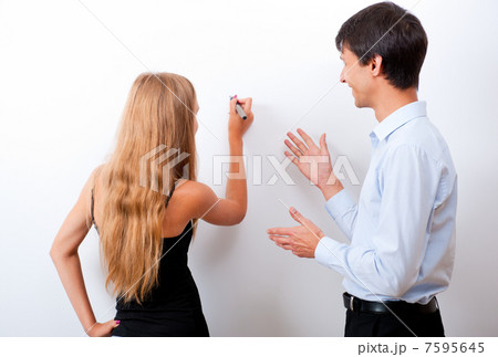 Closeup of adult teacher with student - explaining something Closeup of adult teacher with student - explaining something 7595645