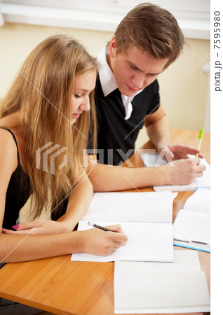 Portrait of a young group of students paying attention and doing Portrait of a young group of students paying attention and doing 7595980