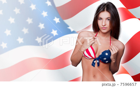 20-25 years old beautiful woman in swimsuit with american flag a 20-25 years old beautiful woman in swimsuit with american flag a 7596657