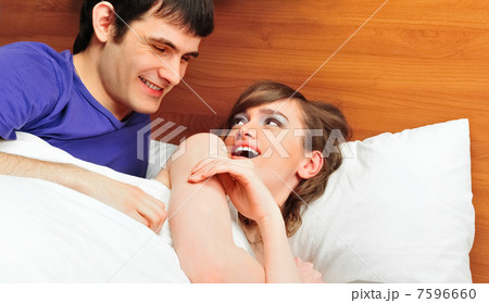 Young man and woman in bed. Couple. Young man and woman in bed. Couple. 7596660