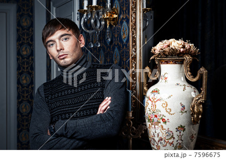 Elegant man posing in a stylish interior Elegant man posing in a stylish interior 7596675