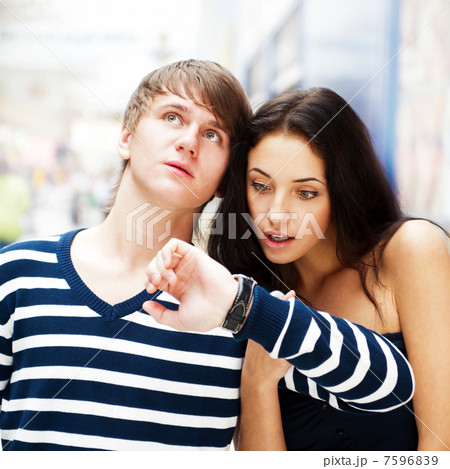 Portrait of young couple standing together at airport hall and l 7596839