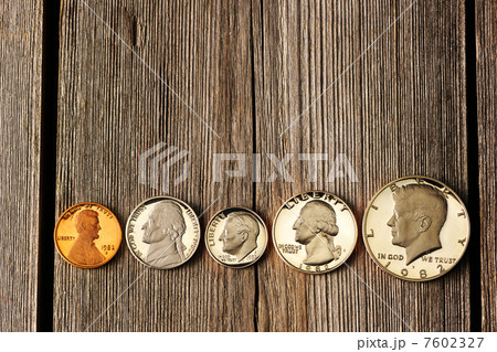 US cent coins over wooden background 7602327