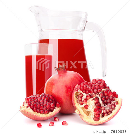 Pomegranate fruit juice in glass pitcher Pomegranate fruit juice in glass pitcher 7610033