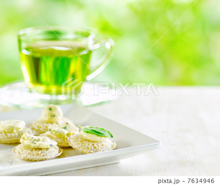 Several canapes and cup of herbal tea. Several canapes and cup of herbal tea. 7634946