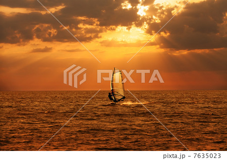Windsurfer sailing in the sea 7635023