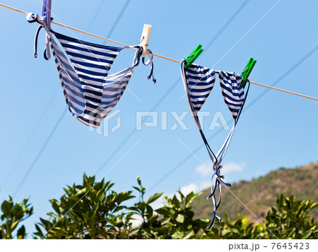 drying female swimsuit outdoor 7645423