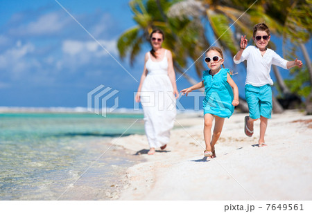 Beautiful family on a beach 7649561