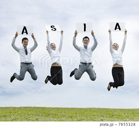 Asian man & woman jumping holding with a sign Asian man & woman jumping holding with a sign 7655328