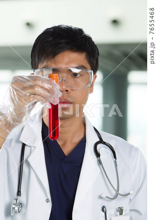 Portrait of scientist analyzing a solution. Portrait of scientist analyzing a solution. 7655468