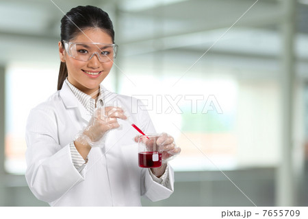Portrait of scientist analyzing a solution. Portrait of scientist analyzing a solution. 7655709