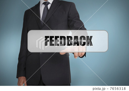 Businessman selecting the word feedback written on white tag 7656318