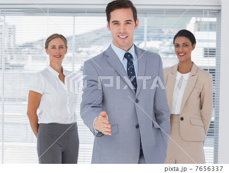 Attractive businessman offering his hand 7656337