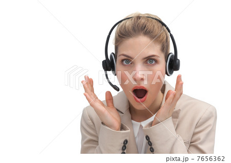 Surprised call center agent with hands raised Surprised call center agent with hands raised 7656362