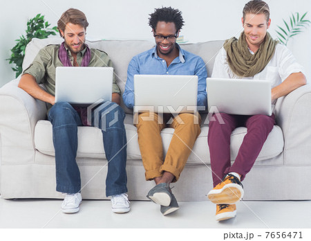 Handsome designers working with laptops Handsome designers working with laptops 7656471
