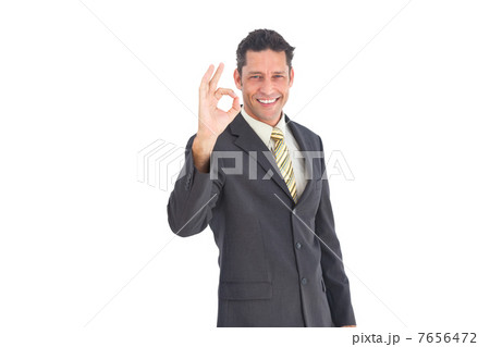 Smiling businessman saying ok Smiling businessman saying ok 7656472