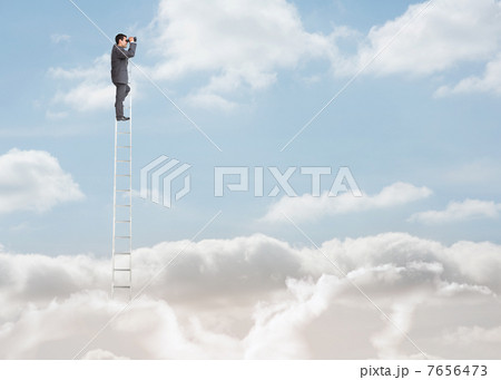 Businessman standing on a ladder over the clouds Businessman standing on a ladder over the clouds 7656473