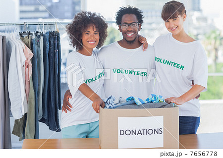 Volunteers standing together in their office 7656778