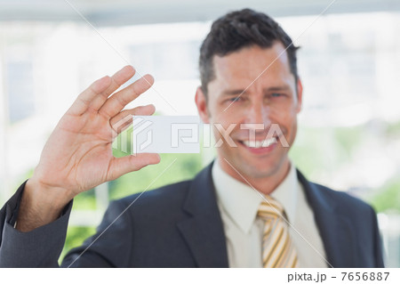 Businessman showing blank business card 7656887