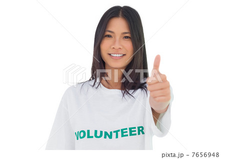 Pretty volunteer woman with thumb up 7656948