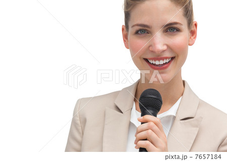 Classy businesswoman holding microphone Classy businesswoman holding microphone 7657184